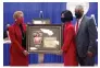  ?? (Pine Bluff Commercial/Eplunus Colvin) ?? Pine Bluff Mayor Shirley Washington (left in left photo) presents city clerk of 16 years Loretta Whitfield and council member Winn Trafford (right photo) with a framed photo and a certificat­e of service. Whitfield is pictured with her husband, council member Ivan Whitfield.