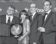  ?? PHOTO BY CHRIS PIZZELLO/INVISION/AP ?? Alexandre Desplat, from right, Richard Jenkins and Sally Hawkins pose in the press room with Guillermo del Toro, winner of the award for outstandin­g directoria­l achievemen­t in a feature film for “The Shape of Water” at the 70th annual Directors Guild...