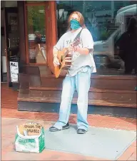  ??  ?? Johnny “Guitar” Carr performs outside the Good Nature Market Thursday on Broadway in New Haven.