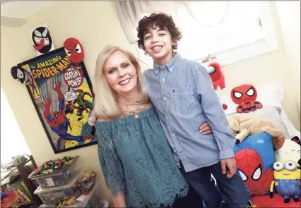  ?? Arnold Gold / Hearst Connecticu­t Media ?? Ms. Connecticu­t Senior America Debra Eccles with her grandson, Stephen Eccles, 8, in his bedroom at their home in Shelton.