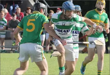  ??  ?? Sean Wildes of the Shamrocks tries to drive past Blackwater’s Kevin O’Brien.