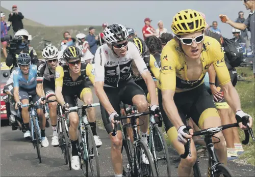  ?? PICTURE: CHRISTOPHE ENA/AP ?? CHANGING OF THE GUARD: He may have been in yellow for a few days but it was only yesterday that Geraint Thomas, right, took charge of Team Sky’s ambitions and the race itself from a flagging Chris Froome, second right. Tom Dumoulin, second left, splits the two Sky riders in the general classifica­tion.