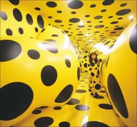  ?? Mattress Factory ?? Japanese artist Yayoi Kusama in her installati­on "Dots Obsession" at Mattress Factory museum in 1996.