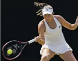  ?? KIRSTY WIGGLESWOR­TH ASSOCIATED PRESS ?? Evgeniya Rodina returns the ball to Madison Keys during their match Friday at Wimbledon.