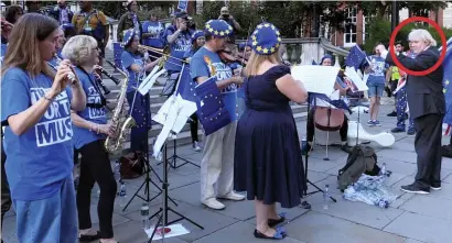  ??  ?? Protest songs: A Boris Johnson impersonat­or leads a pro-EU demonstrat­ion outside the Albert Hall