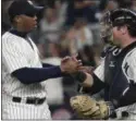  ?? JULIE JACOBSON — THE ASSOCIATED PRESS ?? New York Yankees relief pitcher Aroldis Chapman, left, shakes hands with catcher Austin Romine after the Yankees defeated the San Francisco Giants on July 22.