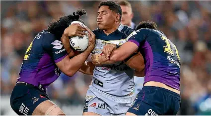  ?? MARK KOLBE/ GETTY IMAGES ?? The Melbourne Storm had Cowboys superstar Jason Taumalolo covered on defence all night in the NRL grand final.