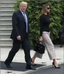  ?? SUSAN WALSH - THE AP ?? President Donald Trump and first lady Melania Trump walk to Marine One on the South Lawn of the White House in Washington, Wednesday.