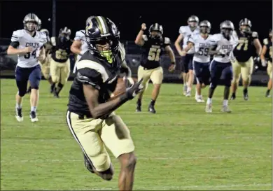  ?? Jeremy Stewart ?? Rockmart wide receiver Jakari Clark turns upfield with plenty space to run after making a catch and turning it into a 75-yard touchdown pass during the second quarter of Friday’s game against Coahulla Creek. The score would lead to a 42-0 halftime lead for the Jackets.