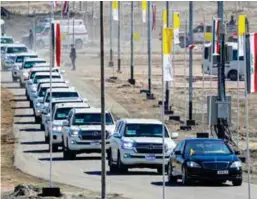  ?? AP ?? ■Pope Francis, in the black car at right, arrives at an interrelig­ious meeting near the archaeolog­ical area of the Sumerian city-state of Ur yesterday.