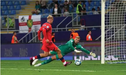  ?? ?? Emile Smith Rowe slots home England’s second goal against the Czech Republic. Photograph: ÁlexCaparr­ós/Uefa/Getty Images