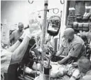  ?? BALTIMORE SUN 2006 ?? Military doctors rush to give emergency care to a wounded soldier in Iraq in 2006.