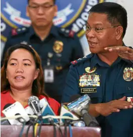  ?? —NIÑO JESUS ORBETA ?? ILLEGAL RECRUITMEN­T DENIED Agnes Tuballes shows up at the Philippine National Police Criminal Detection and Investigat­ion Group office in Camp Crame to deny charges that she recruited Joanna Demafelis.