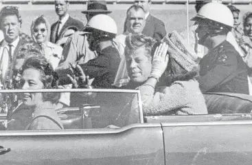  ?? Jim Altgens / Associated Press ?? President John F. Kennedy waves from his car in a motorcade in Dallas on Nov. 22, 1963. Also in the car are first lady Jacqueline Kennedy, Texas Gov. John Connally and his wife, Nellie. President Donald Trump on Saturday said he plans to release 50,000...