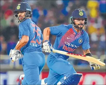  ?? PTI ?? Virat Kohli and Shikhar Dhawan guided India to victory in the raintrunca­ted T20I vs Australia in Ranchi on Saturday.
