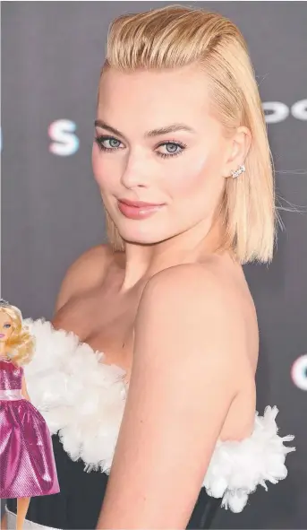  ?? Picture: GETTY IMAGES ?? PERFECT MATCH: Australian actor Margot Robbie has been linked to the role of Barbie in a movie about the famous doll ( left).