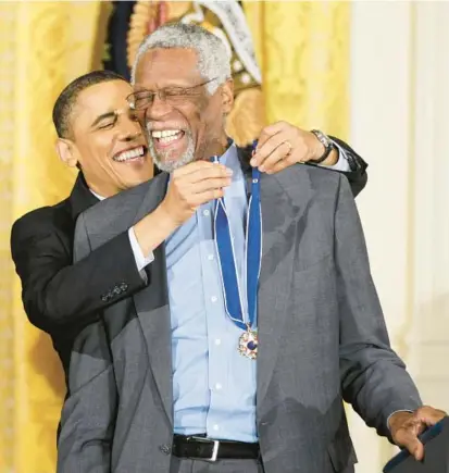  ?? AP FILE ?? Then-President Barack Obama presents Celtics great Bill Russell with the Medal of Freedom in 2011. During the ceremony, Obama referenced the 11-time NBA champion’s long history of activism and said Russell, who died Sunday at age 88,“stood up for rights and dignity of all men.”