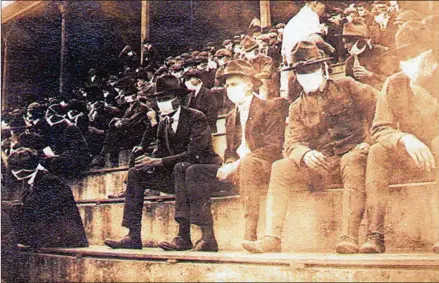  ??  ?? In this photo provided by Georgia Tech alumnus Andy McNeil, Georgia Tech fans attend a home game in 1918. The photo, taken by Tech student Thomas Frederick Carter, McNeil’s great-grandfathe­r, perhaps provides a snapshot of what live sports could look like once they resume in the 21st century. “They had to deal with (a pandemic) back then, and we’re dealing with it now,” Andy McNeil said.