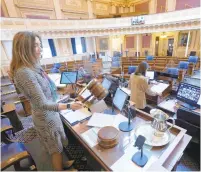  ?? STEVE HELBER/AP ?? Virginia’s Democratic House speaker, Eileen Filler-Corn, presided over an empty chamber this year with delegates working and voting from home.