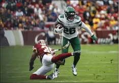  ?? PATRICK SEMANSKY THE ASSOCIATED PRESS ?? New York Jets running back Le’Veon Bell (26) moves past Washington Redskins strong safety Montae Nicholson (35) in the first half of an NFL football game, Sunday, Nov. 17, 2019, in Landover, Md.