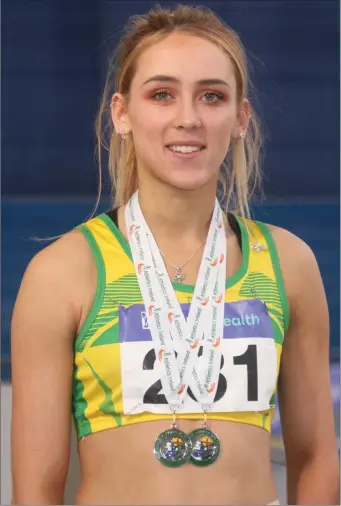  ??  ?? Amy McTeggart with her National Indoor medals.