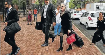  ?? /Alon Skuy ?? Off to court: Raids by the Hawks on Gupta residences led to five arrests and appearance­s in the Bloemfonte­in Regional Court in connection with alleged corruption in the Vrede dairy farm project.