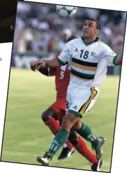  ?? PICTURE ETIENNE ROTHBART ?? Delron Buckley and author Myan Subrayan with copies of the biography. Buckley keeps his eye on the ball during the game against Burkino Faso in 2001.