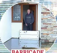  ?? ?? BARRICADE Dave Clark prepared for storms