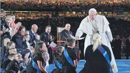  ?? Ciro Fusco EPA/Shuttersto­ck ?? POPE FRANCIS greets children at the World Meeting of Families in Dublin. The church’s role in Ireland has been eroded by scandals.