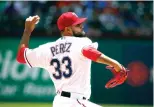  ?? Michael Ainsworth/Associated Press ?? ■ Texas Rangers starting pitcher Martin Perez (33) throws against the Seattle Mariners during the first inning of a baseball game Sunday in Arlington, Texas.