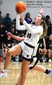  ?? PDN photo by Tom Firme ?? Pocola’s Allyssa Parker goes for a layup.