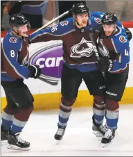  ?? David Zalubowski / Associated Press ?? Avalanche right wing Mikko Rantanen, center, celebrates his overtime goal with defensemen Cale Makar, left, and Tyson Barrie in Game 4 of a playoff series against the Flames in 2019.