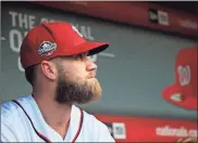  ?? / AP-Manuel Balce Ceneta ?? Washington Nationals’ Bryce Harper, looks at the baseball field from their dug out before the start of the Nationals last home game of the season. Not only didn’t the Nationals get over the hump, they didn’t even make the playoffs. And now the question looming over the franchise becomes whether Bryce Harper will leave as a free agent.