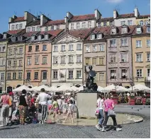  ?? CAMERON HEWITT ?? Visitors to Warsaw are astonished to learn that the ‘medieval’ buildings ringing the Old Town Square are 20th-century reconstruc­tions.