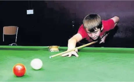 ??  ?? The late Lewis Sewell playing snooker: his barrel roll at Southport FC attracted millions of views