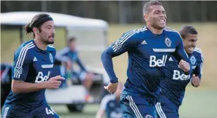  ?? JENELLE SCHNEIDER/ PNG ?? Whitecaps players take to the field at UBC for training camp on Friday.