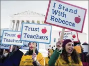  ?? ZACH GIBSON / NYT 2016 ?? Demonstrat­ors support a plaintiff in Friedrichs v. California Teachers Associatio­n, in Washington, 2016. Public-sector unions could lose millions of dollars after Wednesday’s Supreme Court ruling.