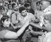  ?? PTI ?? Robbery victims of New Delhi-Patna Rajdhani Express at Patna junction.