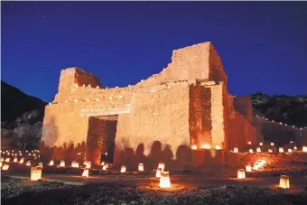  ?? ROBERTO E. ROSALES/JOURNAL ?? The ruins of Giusewa Pueblo and San José de los Jemez Mission Church at Jemez Historic Site were decorated with hundreds of farolitos last year.