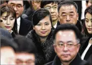  ?? KIM IN-CHUL / YONHAP ?? North Korean singer Hyon Song Wol (center) arrives at the Gangneung Railway Station in Gangneung, South Korea, on Sunday leading Pyongyang’s delegation ahead of next month’s Winter Olympics.