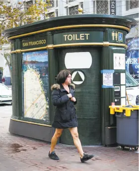  ?? Amy Osborne / Special to The Chronicle ?? The current public toilets, dating to the mid-1990s, have a mock-Parisian design. The aging structures are ready to be replaced.