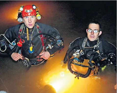  ??  ?? John Volanthen, left, and Rick Stanton, two British caving experts, were the first to reach the 12 trapped junior footballer­s and their coach, top left