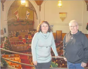  ?? JEREMY FRASER/CAPE BRETON POST ?? Rita Johnston, left, and Billy MacDonald stand on the balcony at St. Andrew’s Presbyteri­an Church in Sydney Mines. The church will host The Miners’ First Noel concert on Dec. 29. All money raised from ticket sales will go to the church.