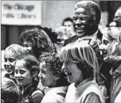  ?? CHUCK BERMAN/CHICAGO TRIBUNE ?? Mayor Harold Washington smiles at the Internatio­nal Folk Fair in 1985, Mary Schmich’s first year at the Tribune.