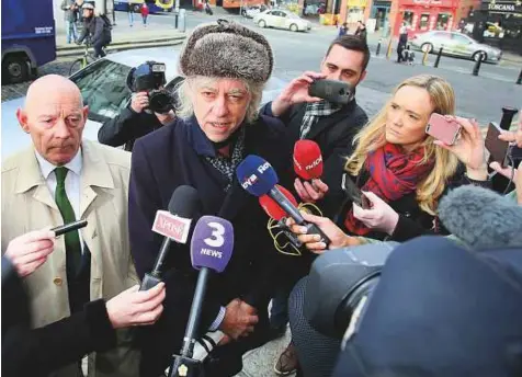  ?? AFP ?? Irish musician Bob Geldof (centre) addresses the media at he arrives at Dublin City Hall on Monday, to return his Freedom of the City of Dublin scroll to protest the atrocities against the Rohingya by the government in Myanmar led by Aung San Suu Kyi.