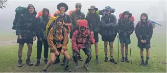  ?? ?? A group of Oakhill students enjoying an early morning walk in the mist during the Oakhill Odyssey.