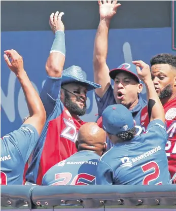  ?? ?? Los Tigres del Licey celebran en el dogaut luego de una victoria en la pasada edición de la Serie del Caribe.