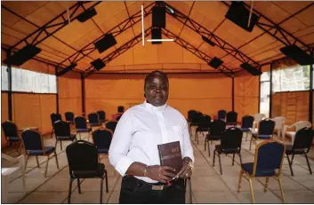  ?? BRIAN INGANGA — THE ASSOCIATED PRESS ?? Associate Pastor Caroline Omolo stands for a portrait at the Cosmopolit­an Affirming Community church, which serves a predominan­tly LGBTQ congregati­on, in Nairobi, Kenya, on Oct. 11. “They have always organized a group to maybe silence us or make the church disappear,” Omolo says. “They don’t want it to appear anywhere.”