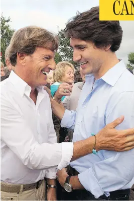  ?? . THE CANADIAN PRESS/FILES ?? Justin Trudeau, right, chats with Stephen Bronfman, at the time the Liberal party’s chief fundraiser, in St. Peters Bay, P.E.I., in August 2013.