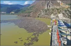  ?? (AP/Eldar Emric) ?? This aerial photo shows trash clogging the Drina River.